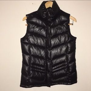 Woman’s North Face black down vest